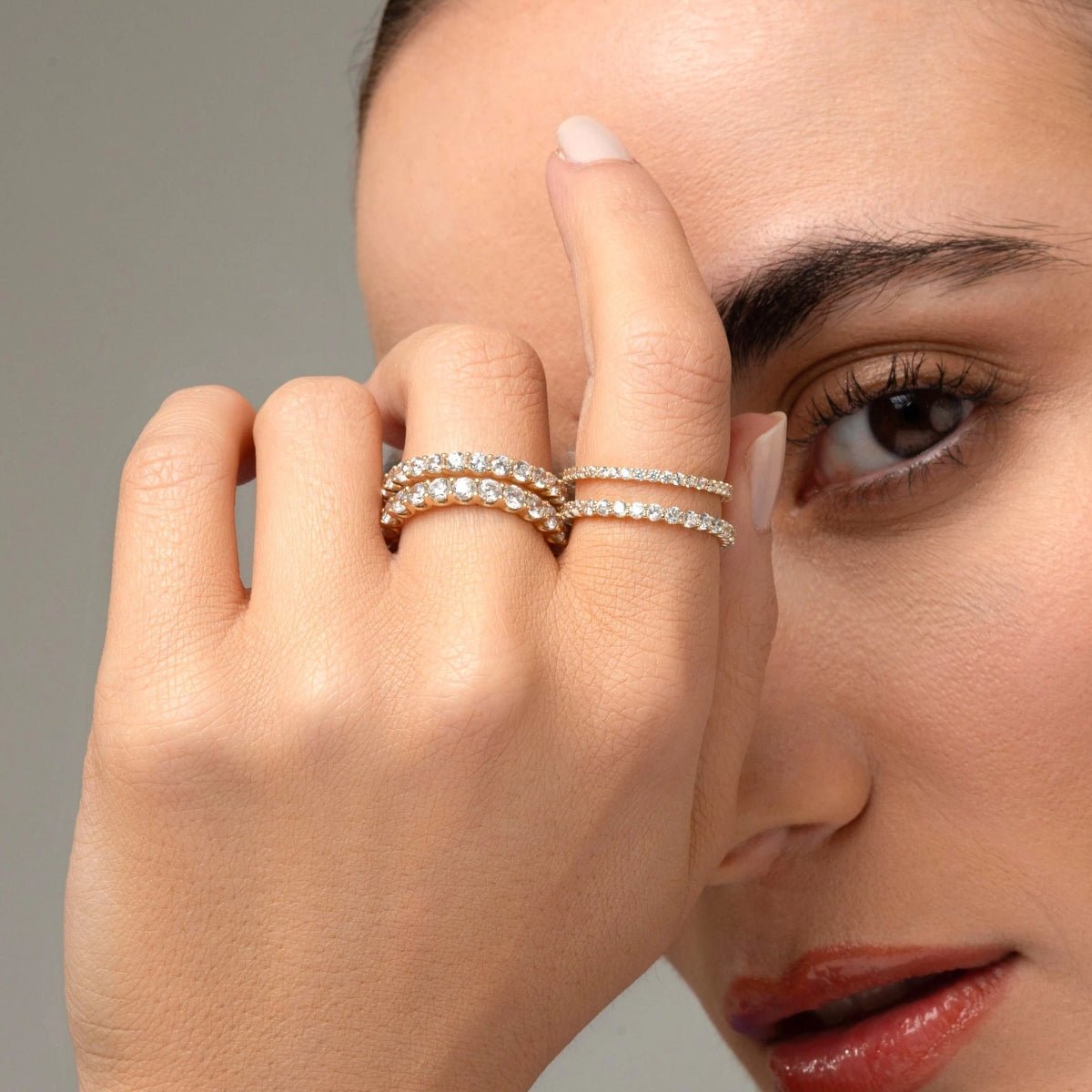 model wearing the diamond eternity ring, showcasing its brilliance and versatility, perfect for stacking or wearing solo