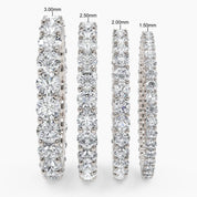 close-up of stacked diamond eternity rings in different widths, highlighting their sleek design and radiant sparkle