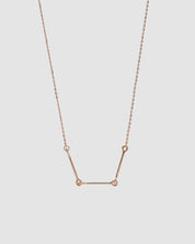 360 video of the Iris Necklace in 14k rose gold, featuring three polished bars connected with rounded loops.
