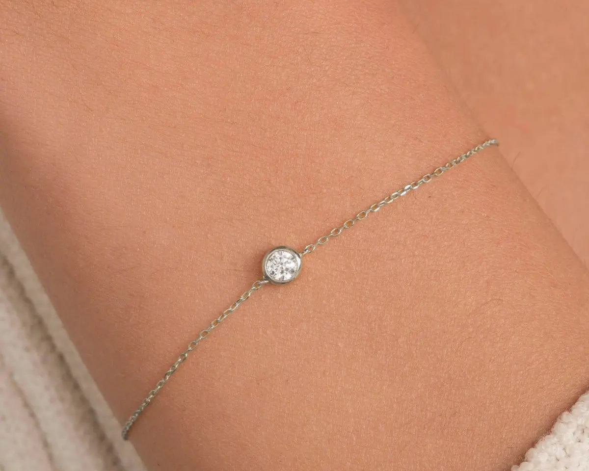 14k white gold diamond bezel bracelet worn on model's wrist by ENEA Studio