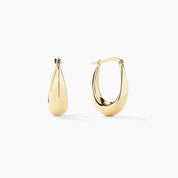 Pair of 14k yellow gold teardrop hoop earrings displayed on a white background.