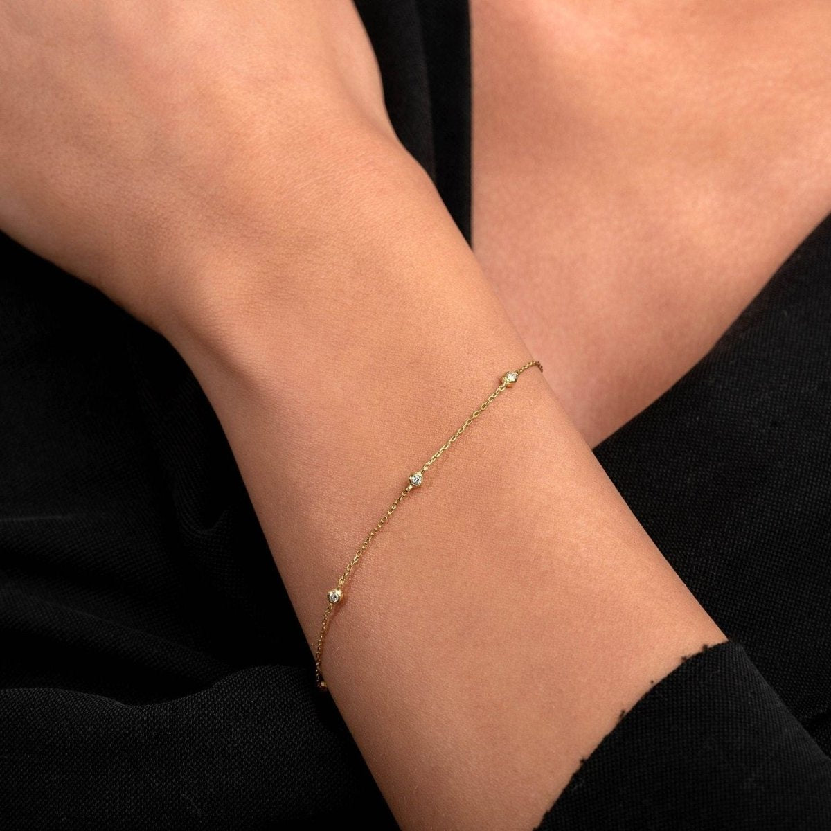 Natural pose shows the diamond bracelet in motion across the wrist, enhancing the everyday elegance vibe.

