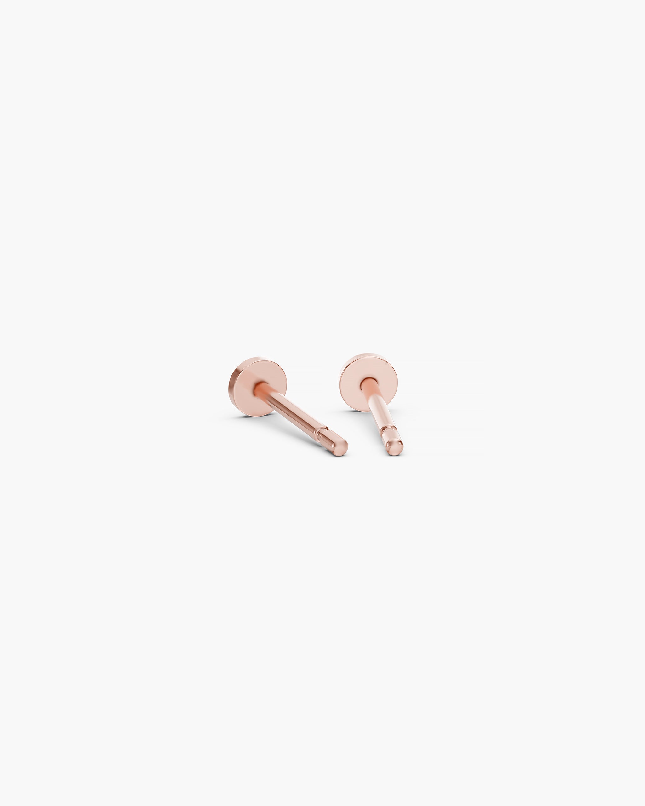 Back view of the Diskos Disc Studs in 14k rose gold showing the flat disc and the 10mm push back post. ENEA Studio