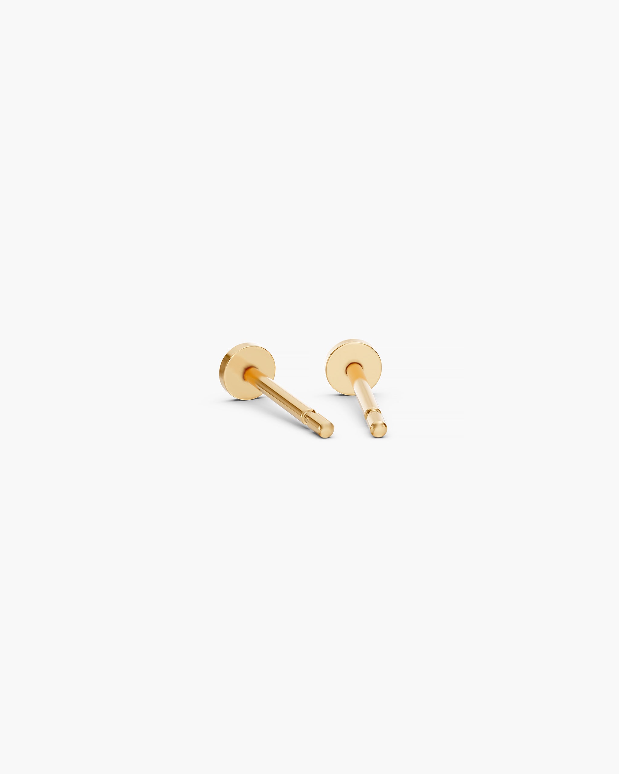 Back view of the Diskos Disc Studs in 14k yellow gold showing the flat disc and the 10mm push back post. ENEA Studio