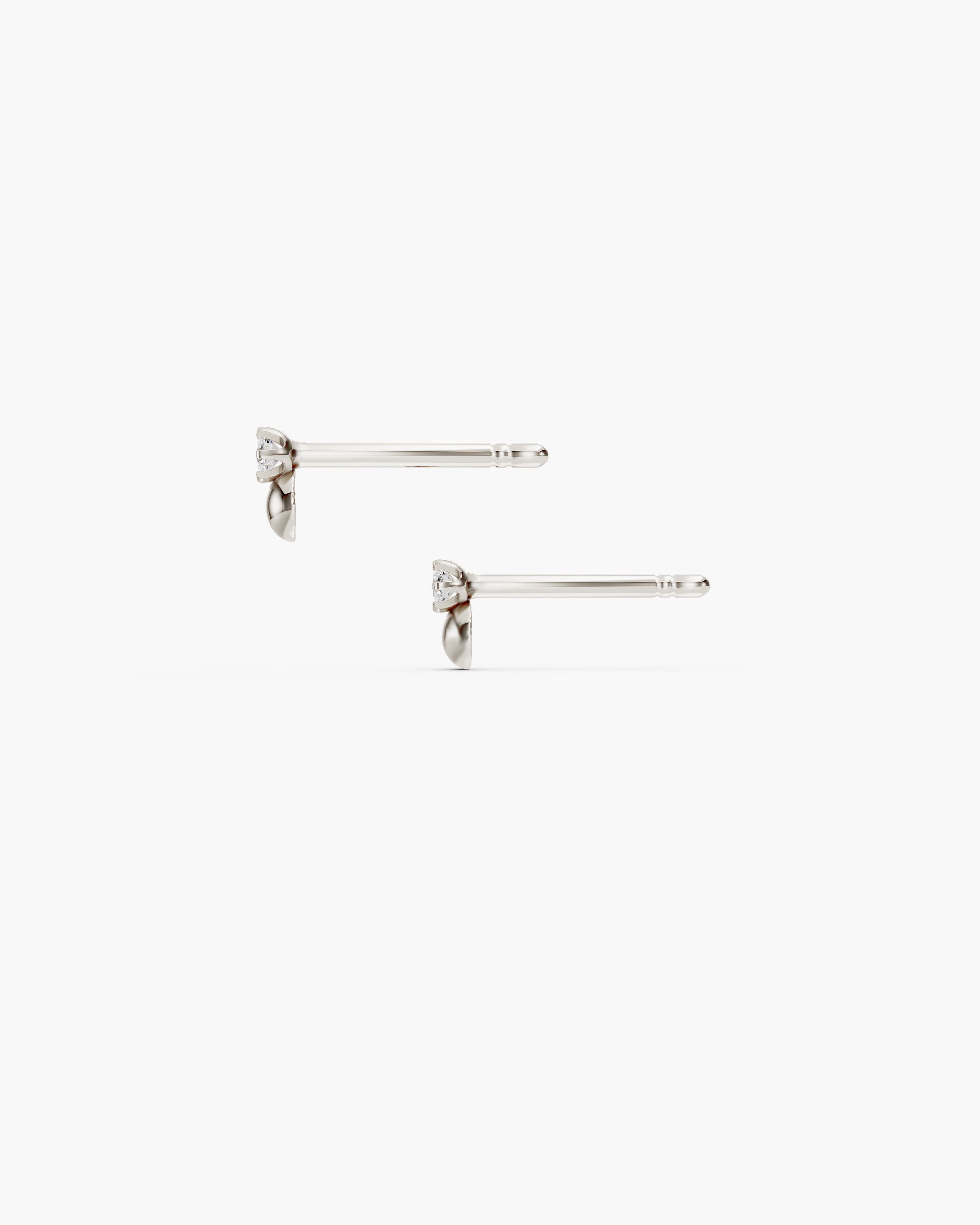 Side view of the Dyo Diamond Bead Studs in 14k white gold showing the prong set diamond, the white gold half bead and the 10mm push back post. ENEA Studio