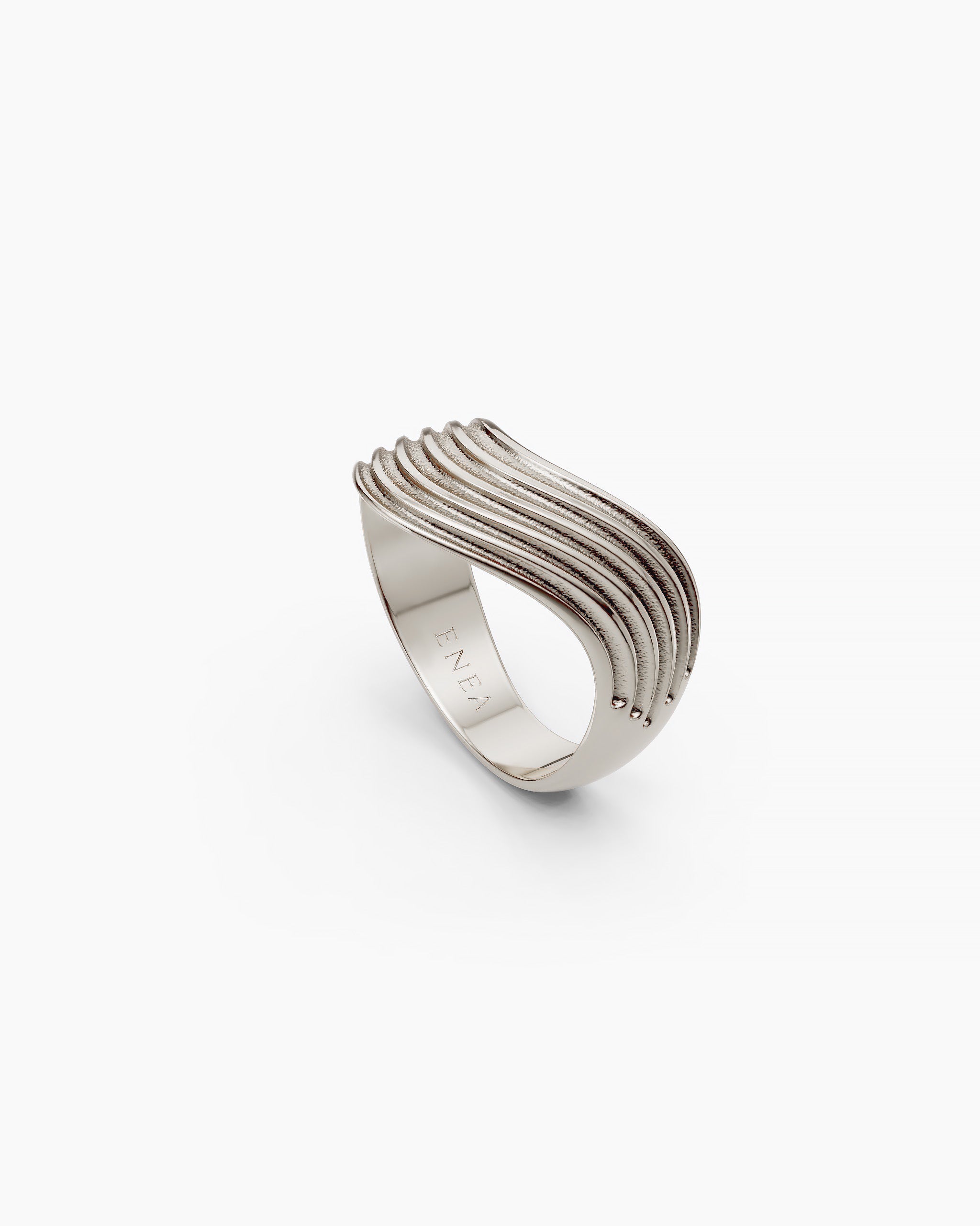 Side view of the Kion III Ribbed Wave Ring in sterling silver with ENEA hallmarked on the inside of the band
