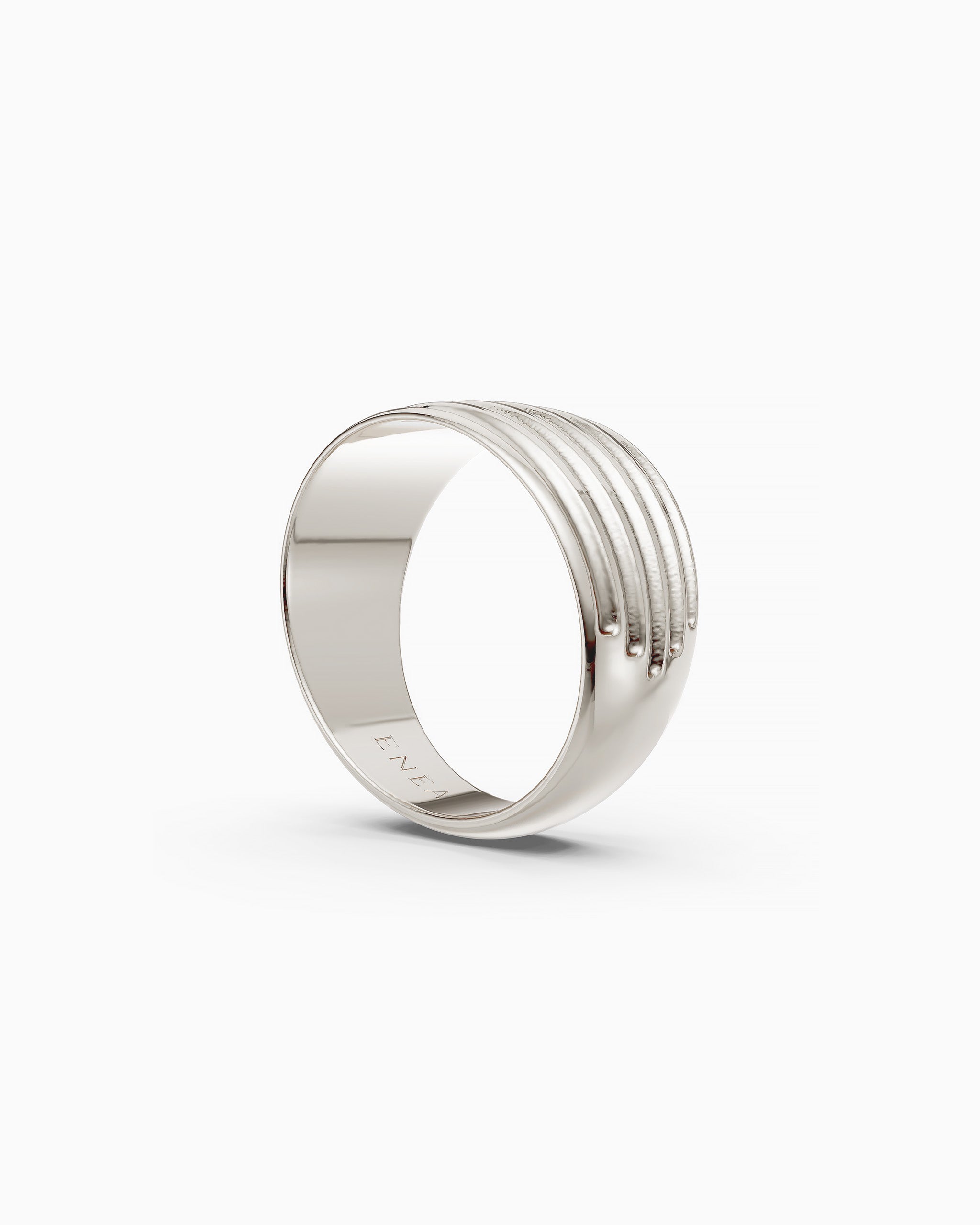 Side view of the Kion II Ribbed Band Ring in sterling silver with ENEA hallmarked on the inside of the band