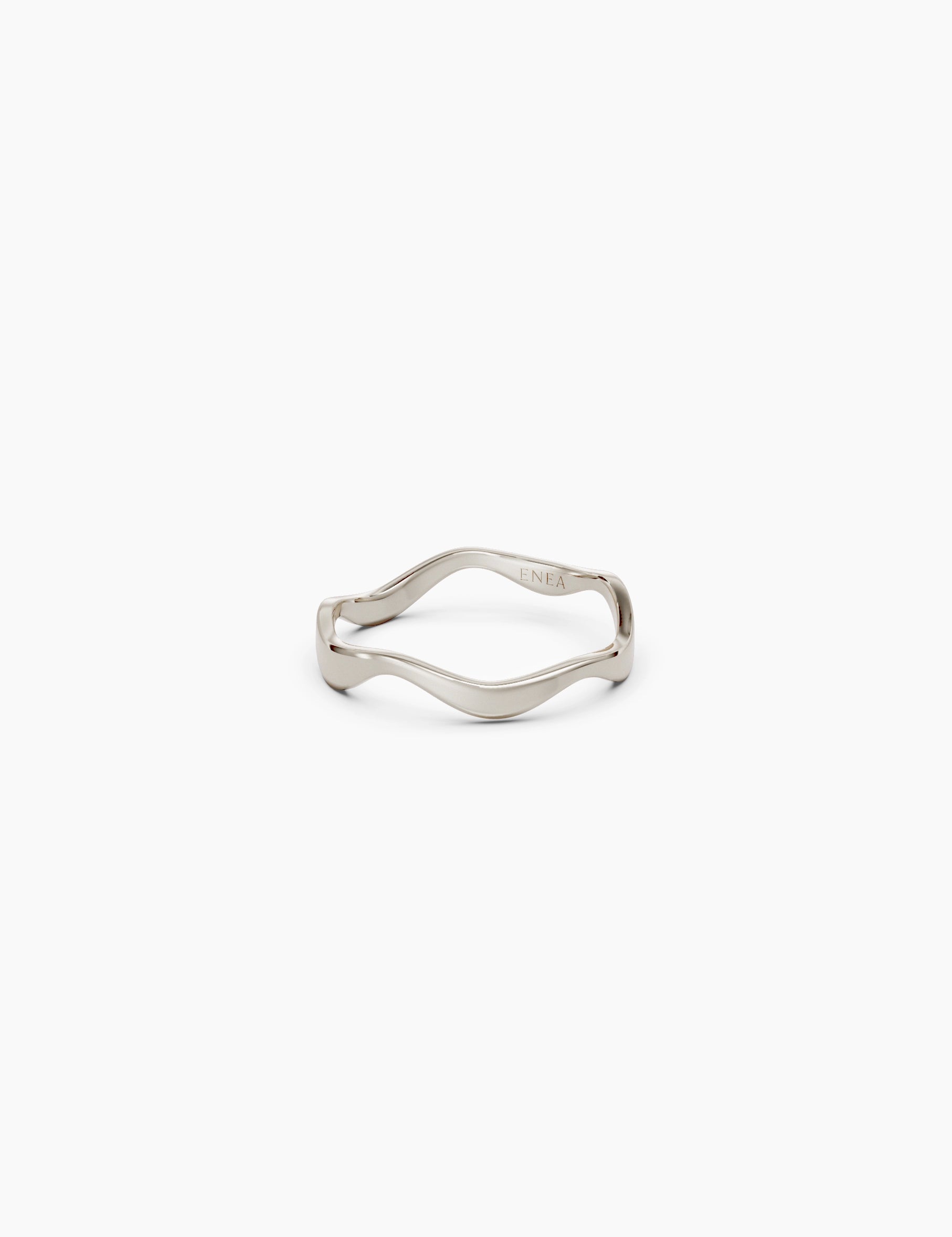 Front view of a 14k white gold wavy band ring with a subtle curvy shape placed on a white background - Enea Studio