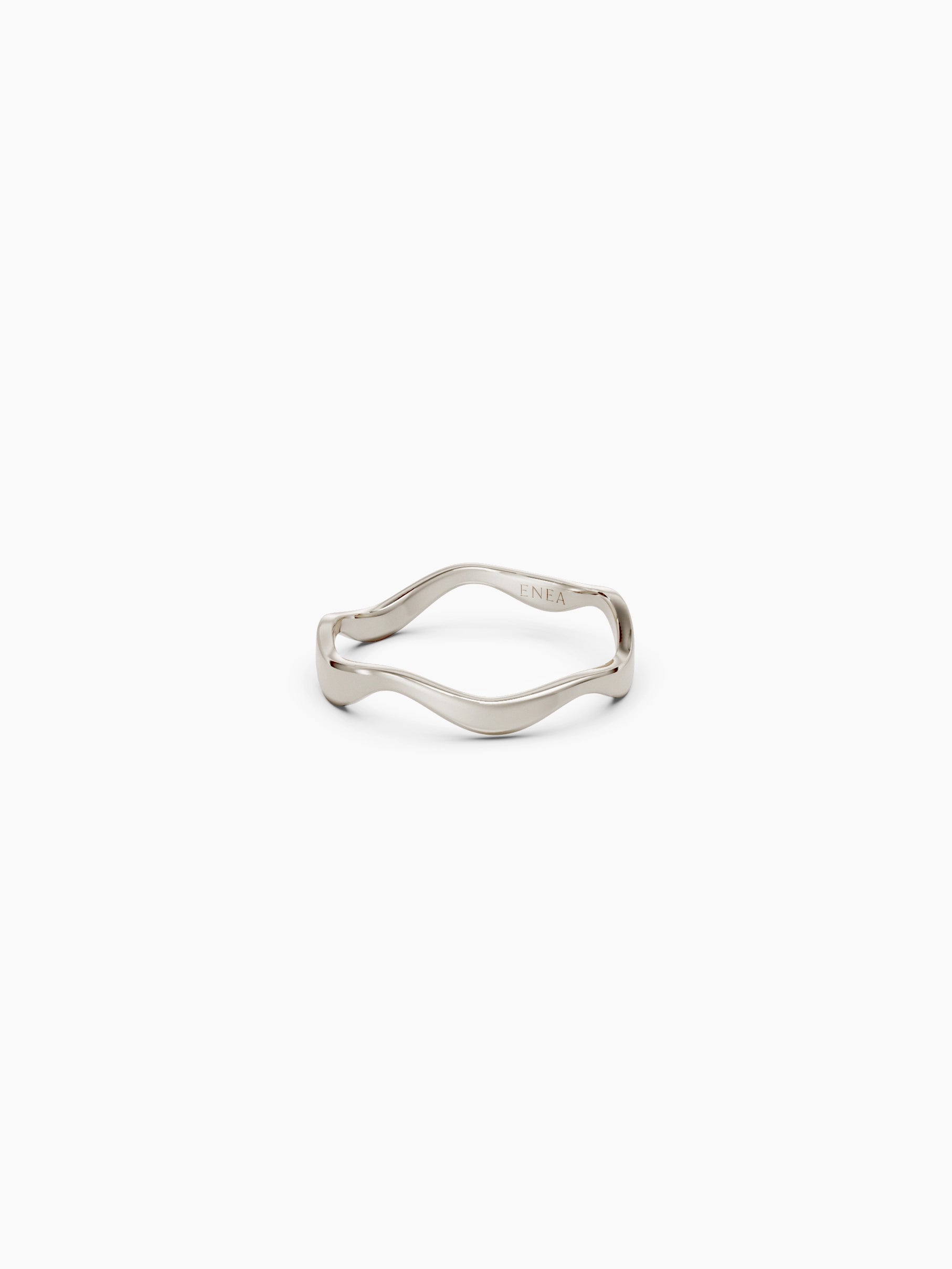 Front view of a 14k white gold wavy band ring with a subtle curvy shape placed on a white background - Enea Studio