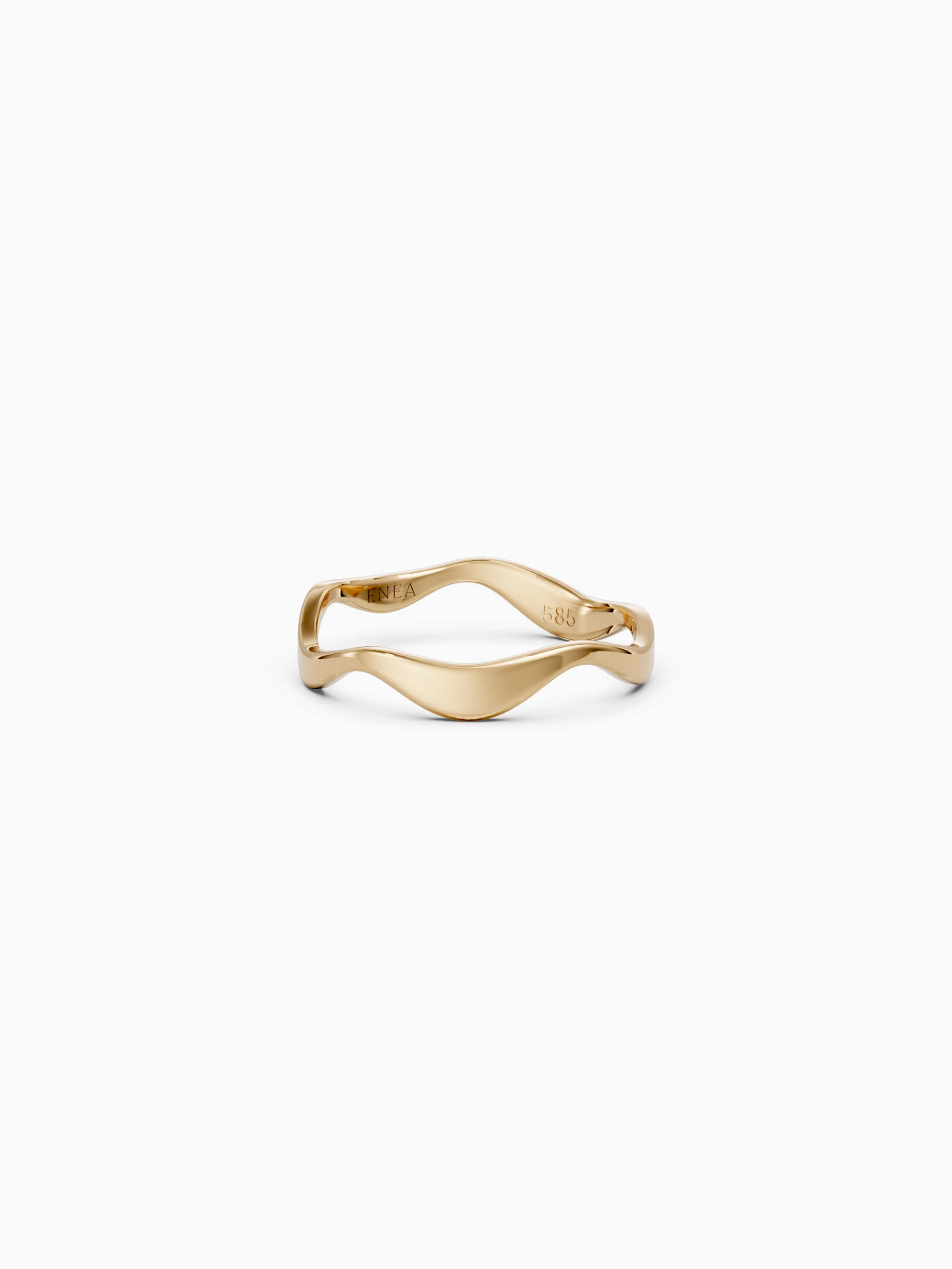 Side view of a yellow gold wavy band ring with a subtle curvy shape placed on a white background - Enea Studio