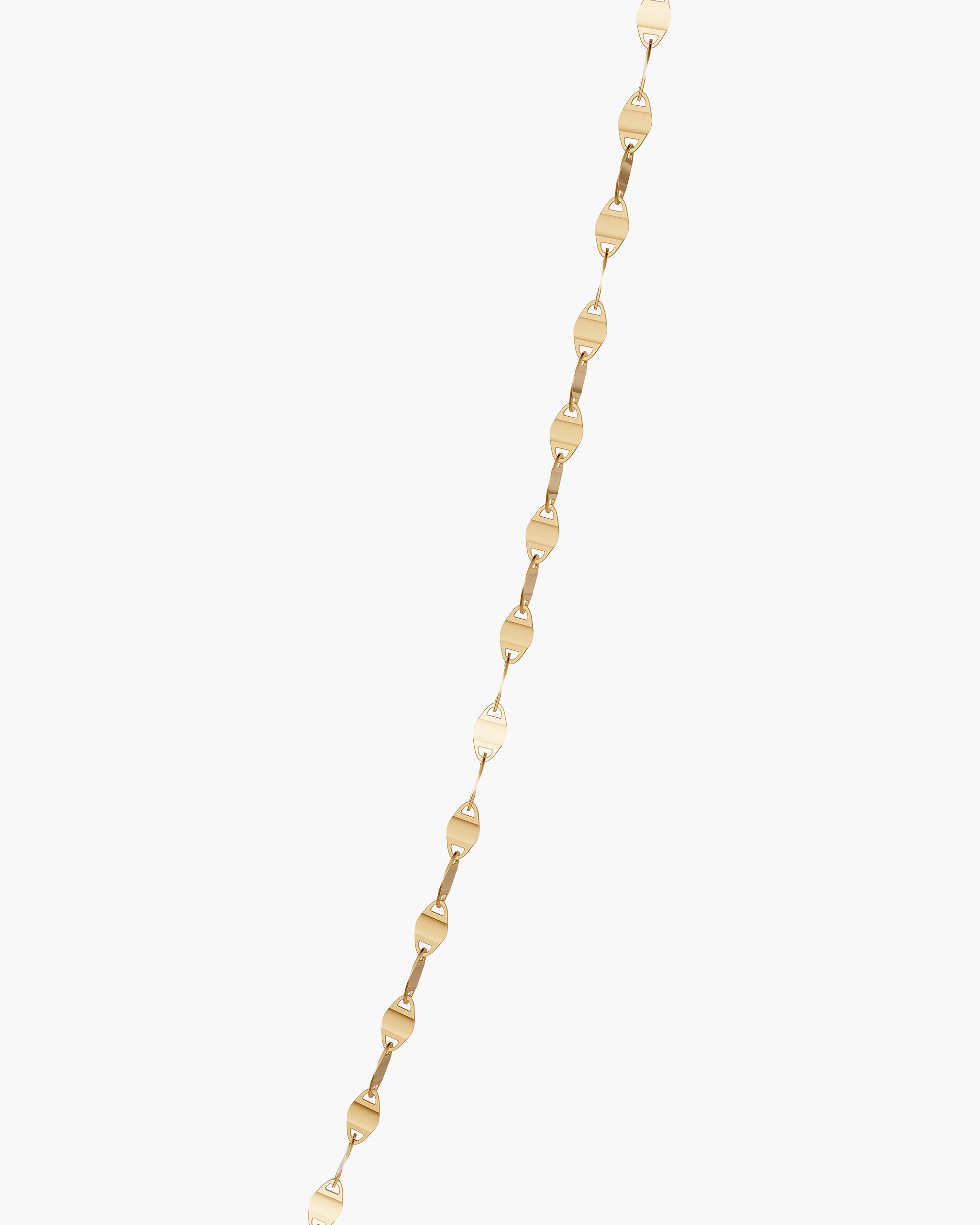 Close up of the pressed and polished mirror links of the Marina chain in 14k gold, ENEA Studio