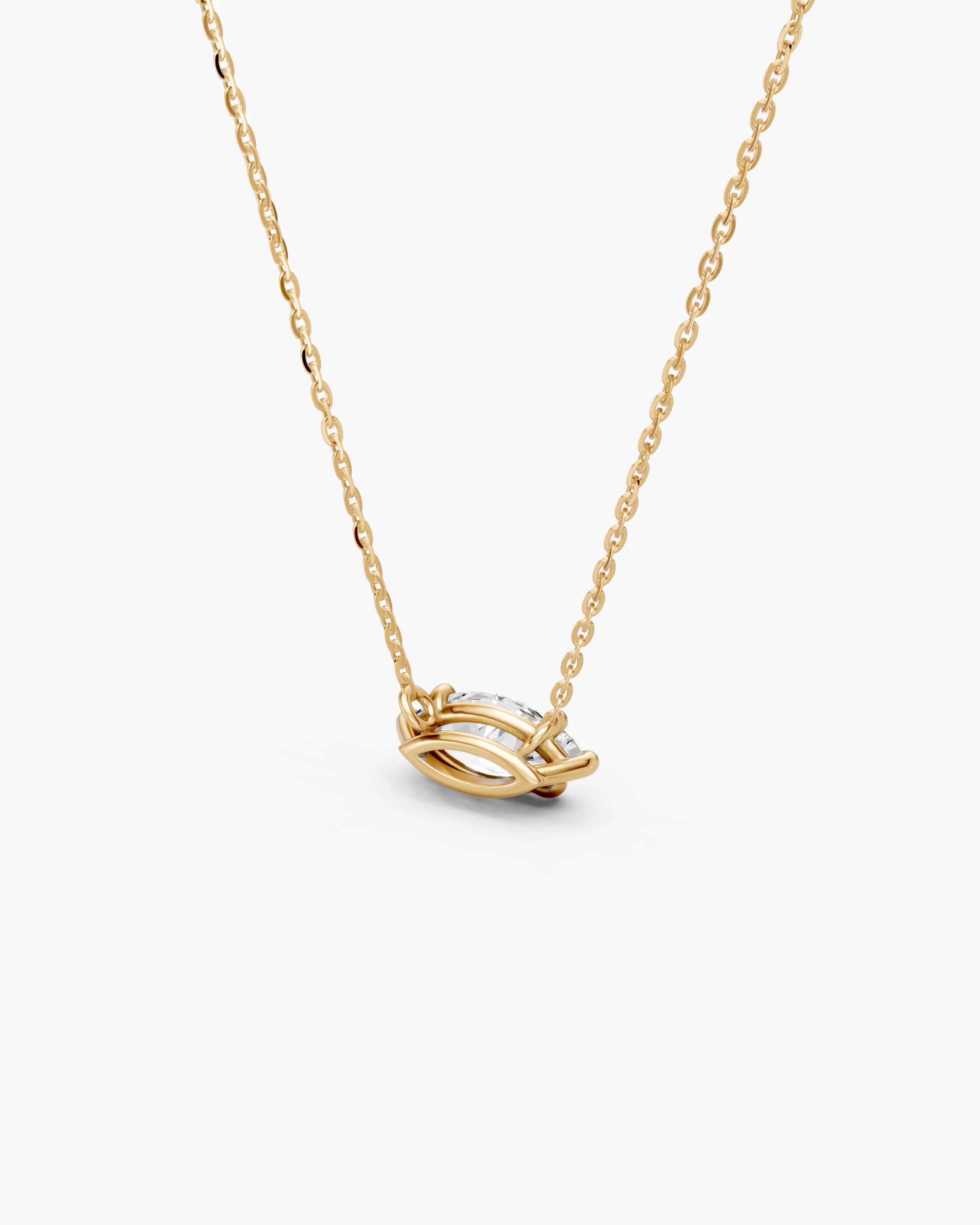 Side view of the four claw marquise setting in 14k yellow gold, ENEA Studio