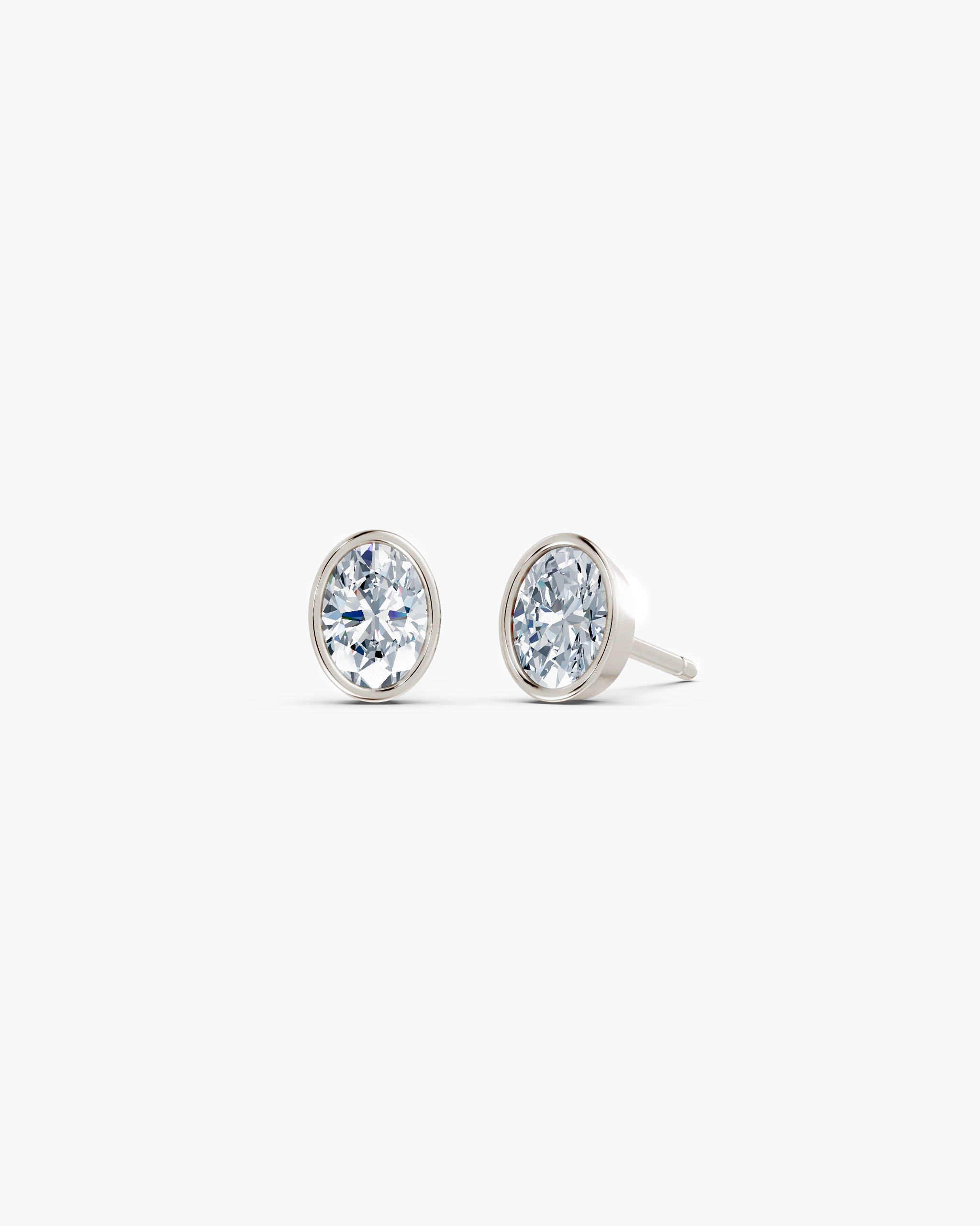 Oval bezel lab diamond stud earrings in 14k white gold, 0.75 ct each, smooth gold rim setting, ENEA Studio