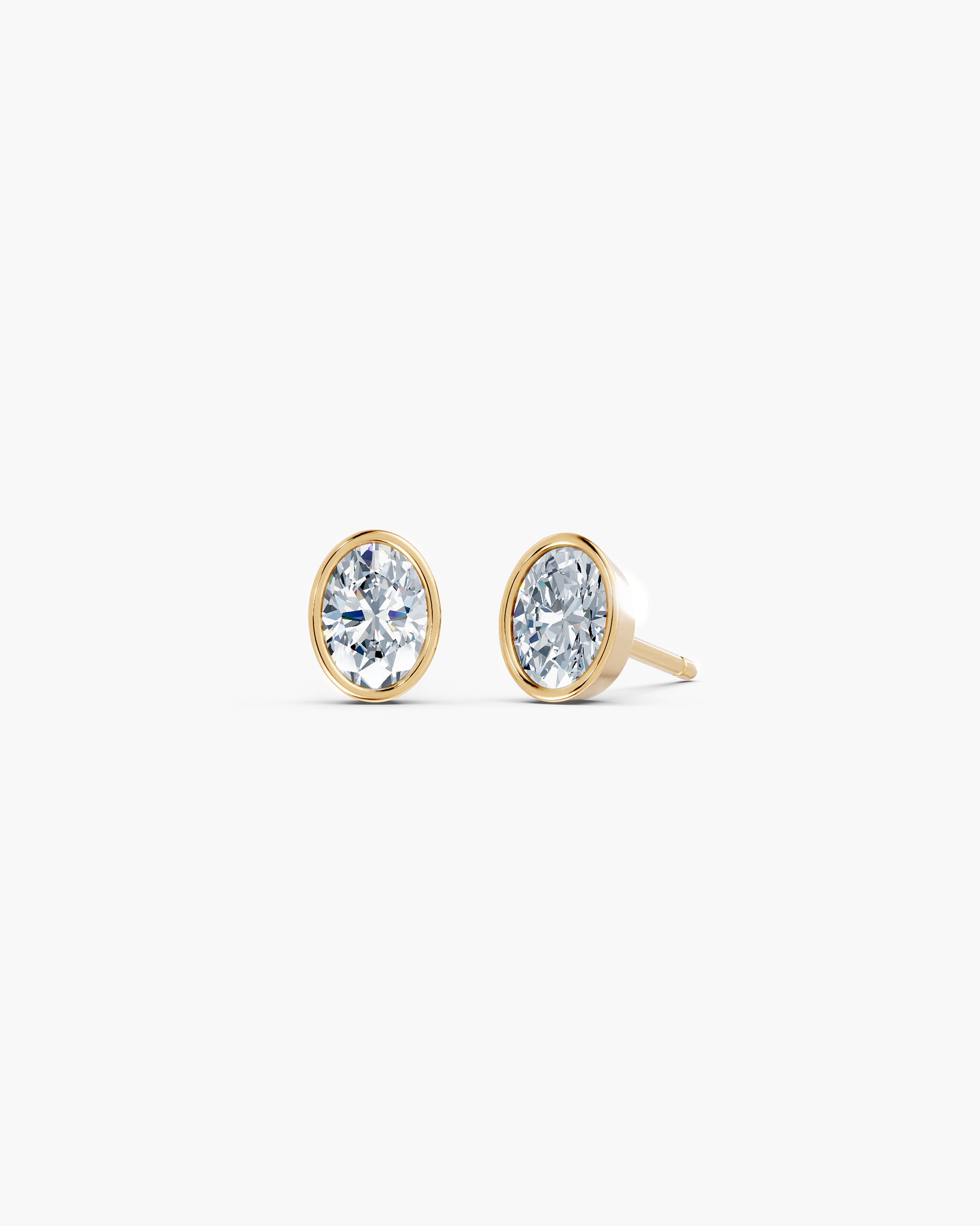 Oval bezel lab diamond stud earrings in 14k yellow gold, 0.75 ct each, smooth gold rim setting, ENEA Studio