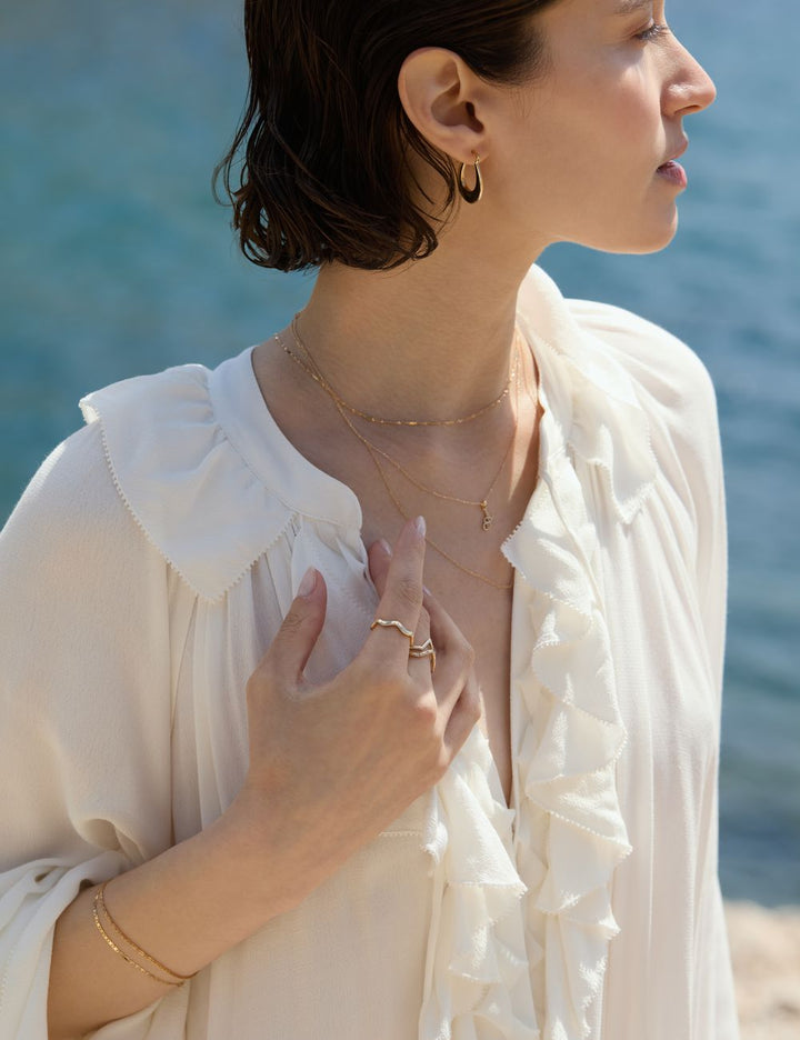 Bride in white wearing fine gold jewelry, ENEA Studio