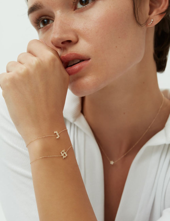 Initial charm bracelets in 14k gold, ENEA Studio