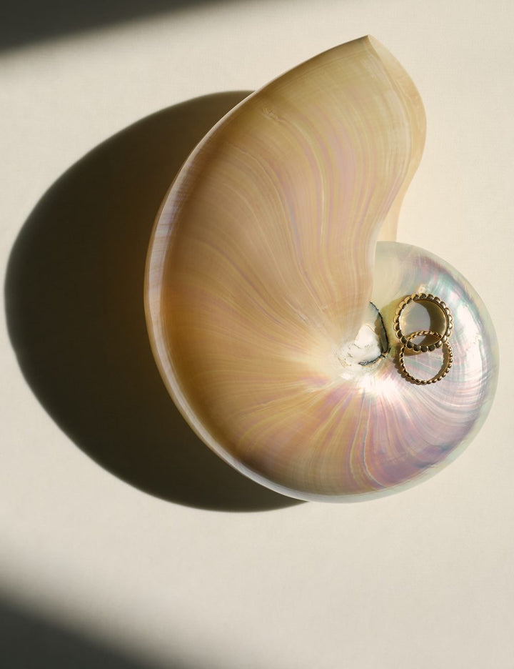Model wearing a curved diamond ring, ENEA Studio