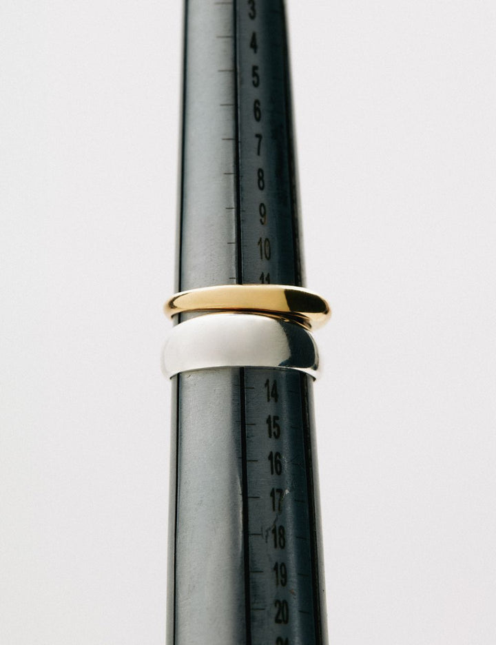 Solid gold rings on a goldsmith mandrel in Athens, ENEA Studio