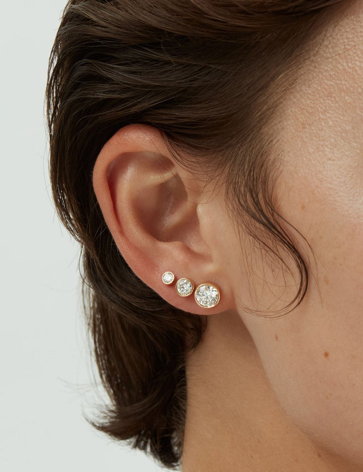 Diamond stud earrings stacked on the ear, ENEA Studio