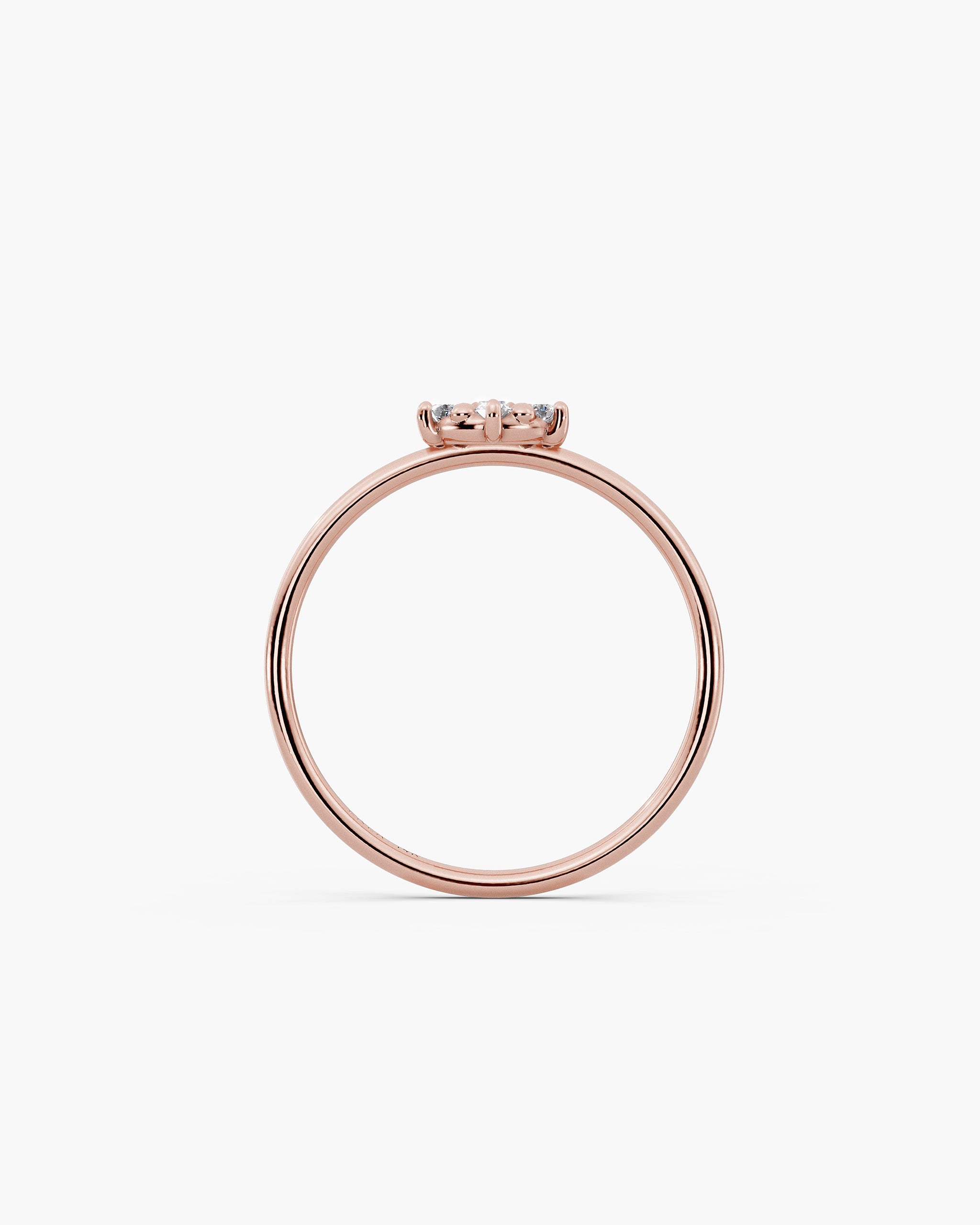 Through finger view of the Selas Diamond Cluster Ring in 14k rose gold, the cluster sitting 2.7mm above the 1.2mm band. ENEA Studio