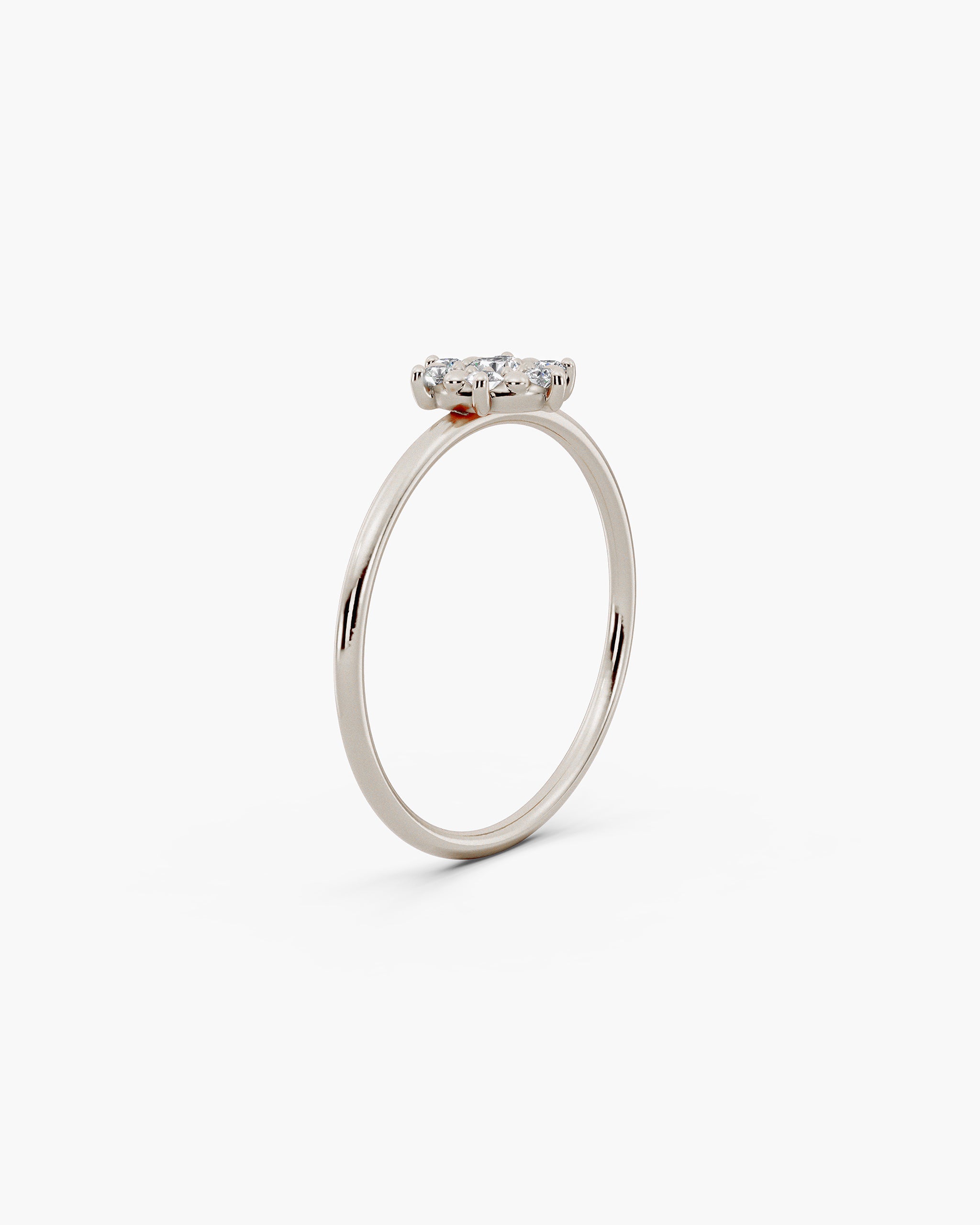 Angled view of the Selas Diamond Cluster Ring in 14k white gold showing the low set cluster and the slim round band. ENEA Studio