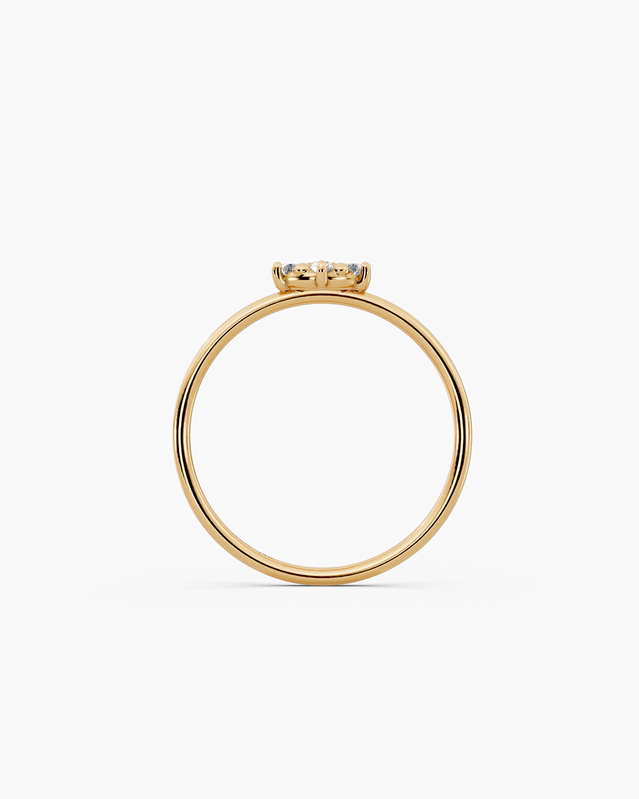 Through finger view of the Selas Diamond Cluster Ring in 14k yellow gold, the cluster sitting 2.7mm above the 1.2mm band. ENEA Studio
