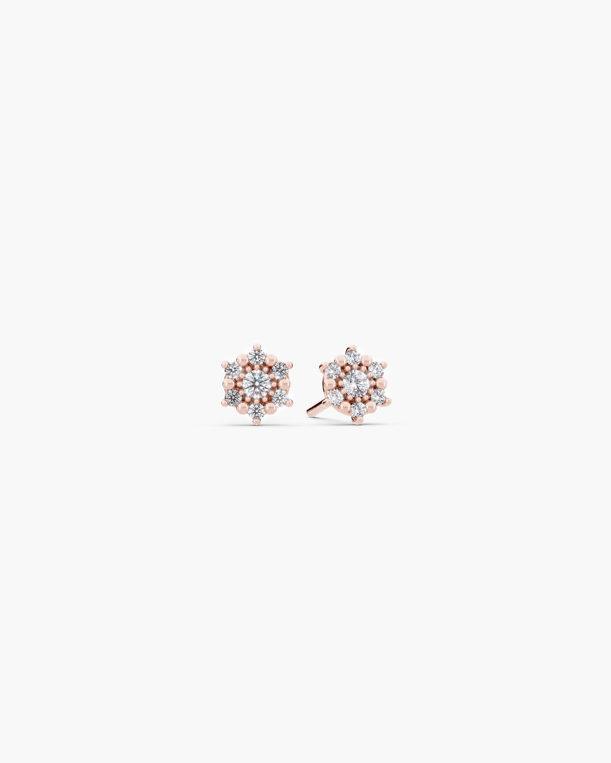 Selas Diamond Cluster Studs in 14k rose gold, front view, a pair of seven stone lab grown diamond cluster stud earrings on an off-white surface. ENEA Studio