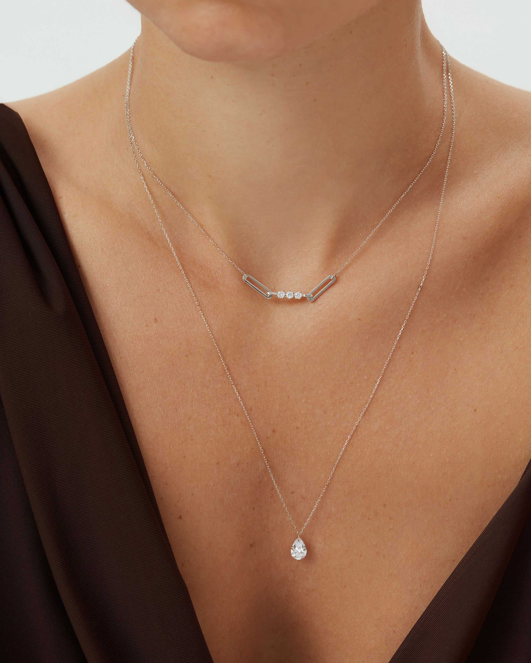 Tria diamond paperclip necklace in 14k white gold layered with a pear diamond pendant, ENEA Studio