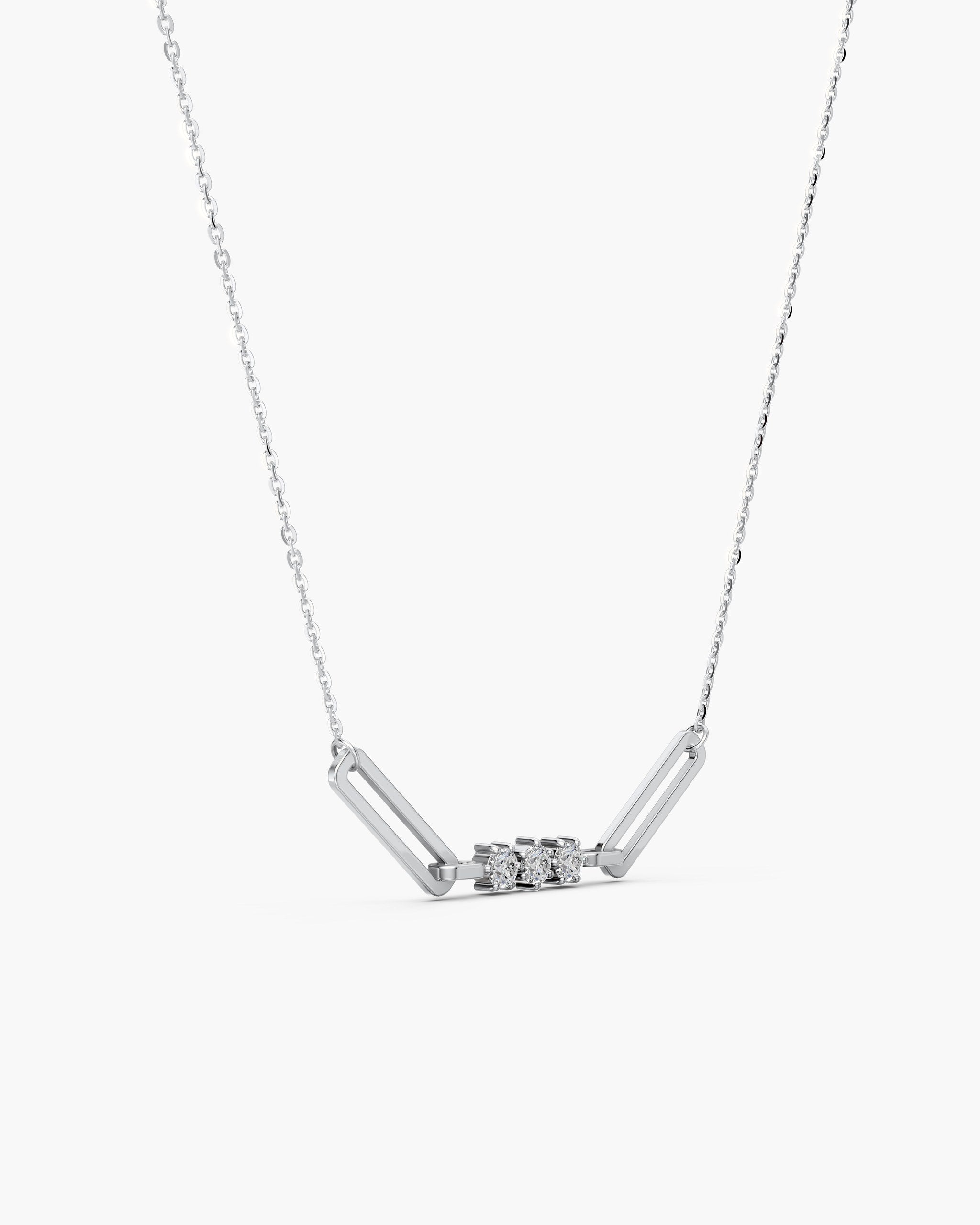 Side view of the Tria paperclip pendant in 14k white gold showing the six prong settings, ENEA Studio