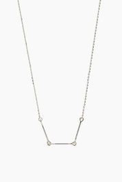 Front-facing product image of the Iris Necklace in 14k white gold, featuring three polished bars connected with rounded loops.