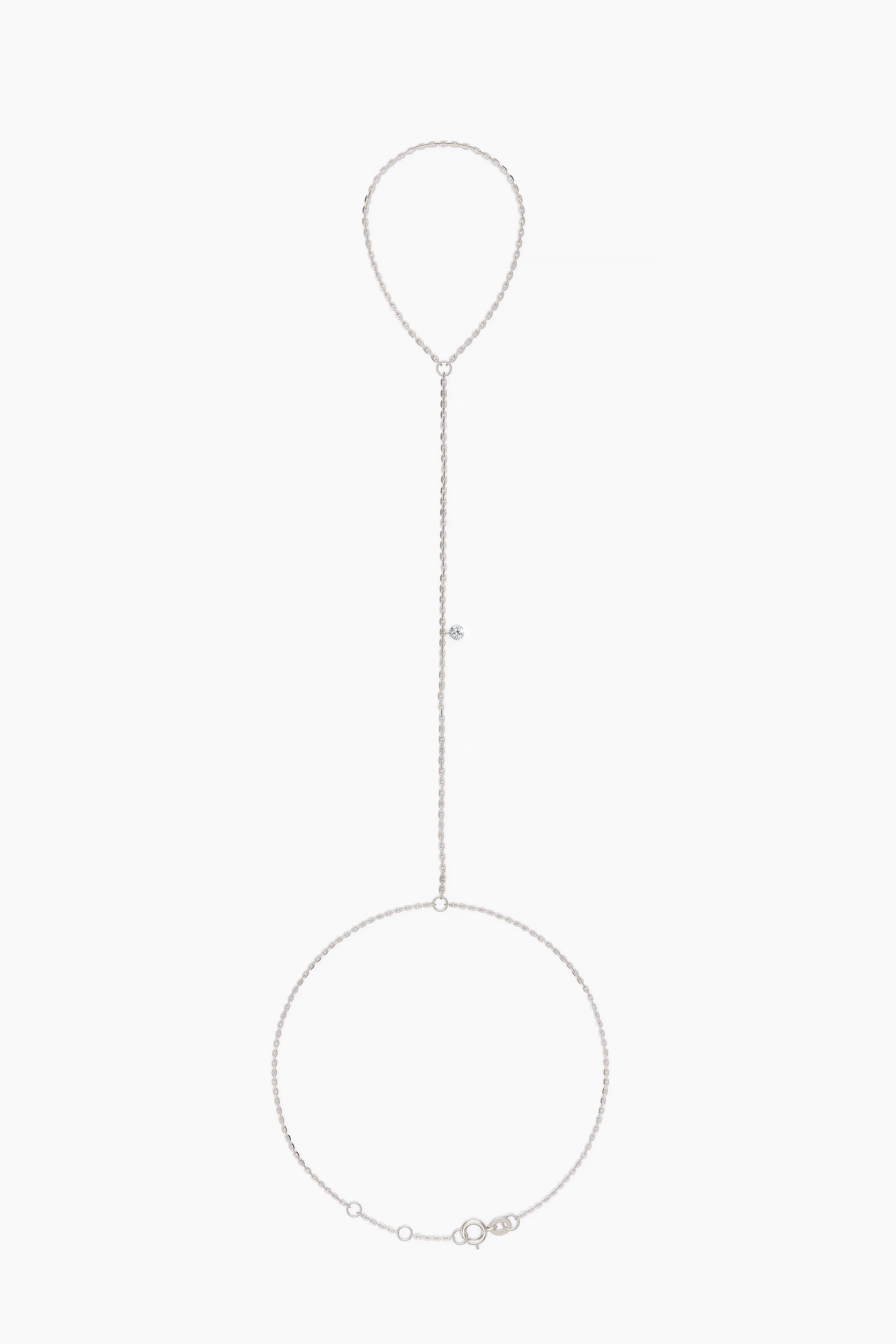 white gold hand chain with small diamond on a white background