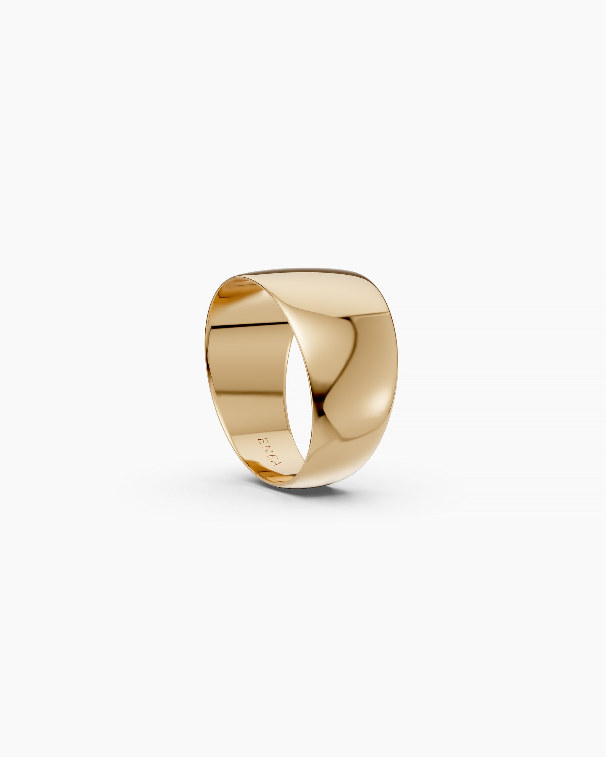 Wide polished gold dome ring, angled view, stamped ENEA