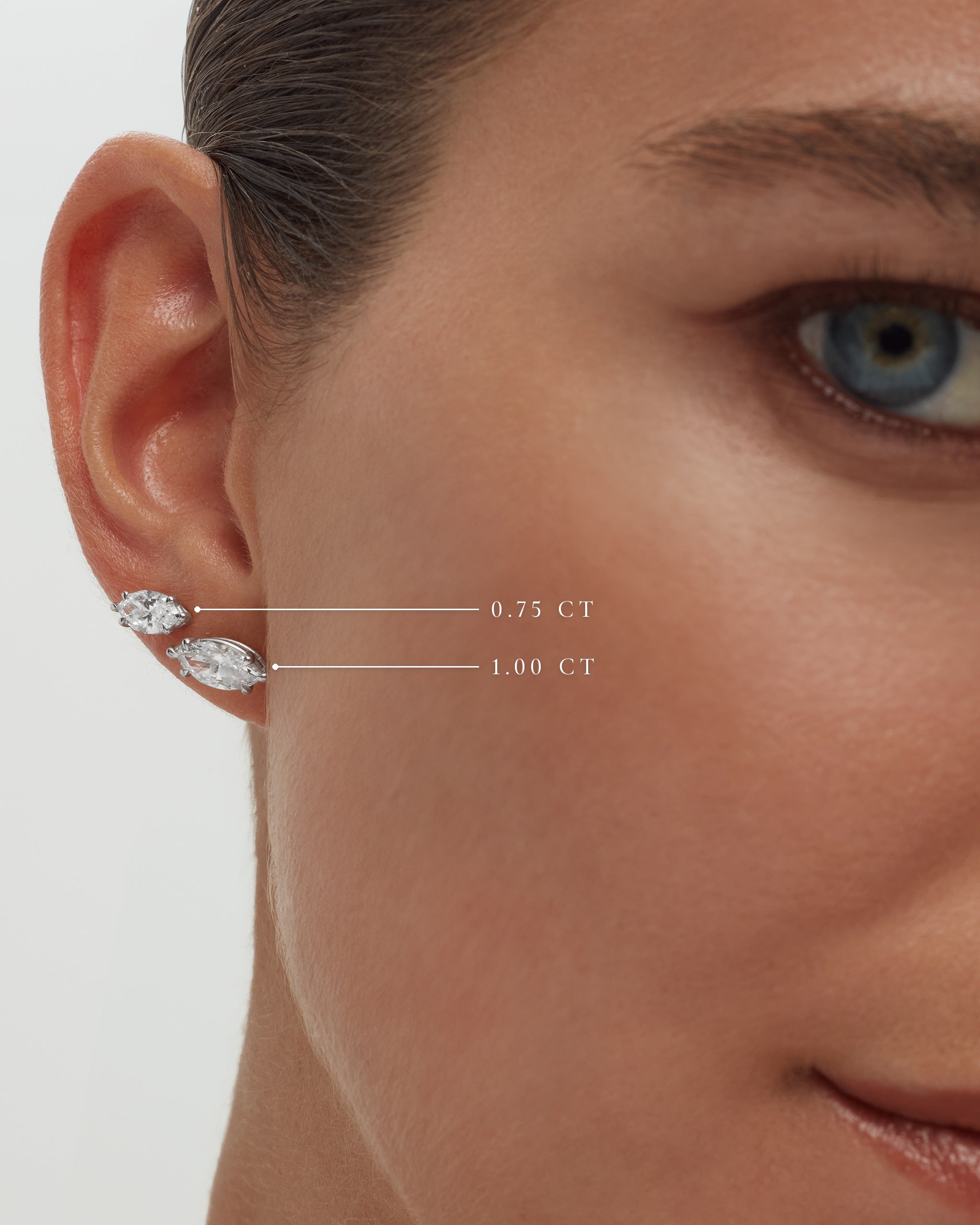 Marquise diamond studs in white gold on the ear, 0.75 and 1.00 carat sizes labelled, ENEA Studio