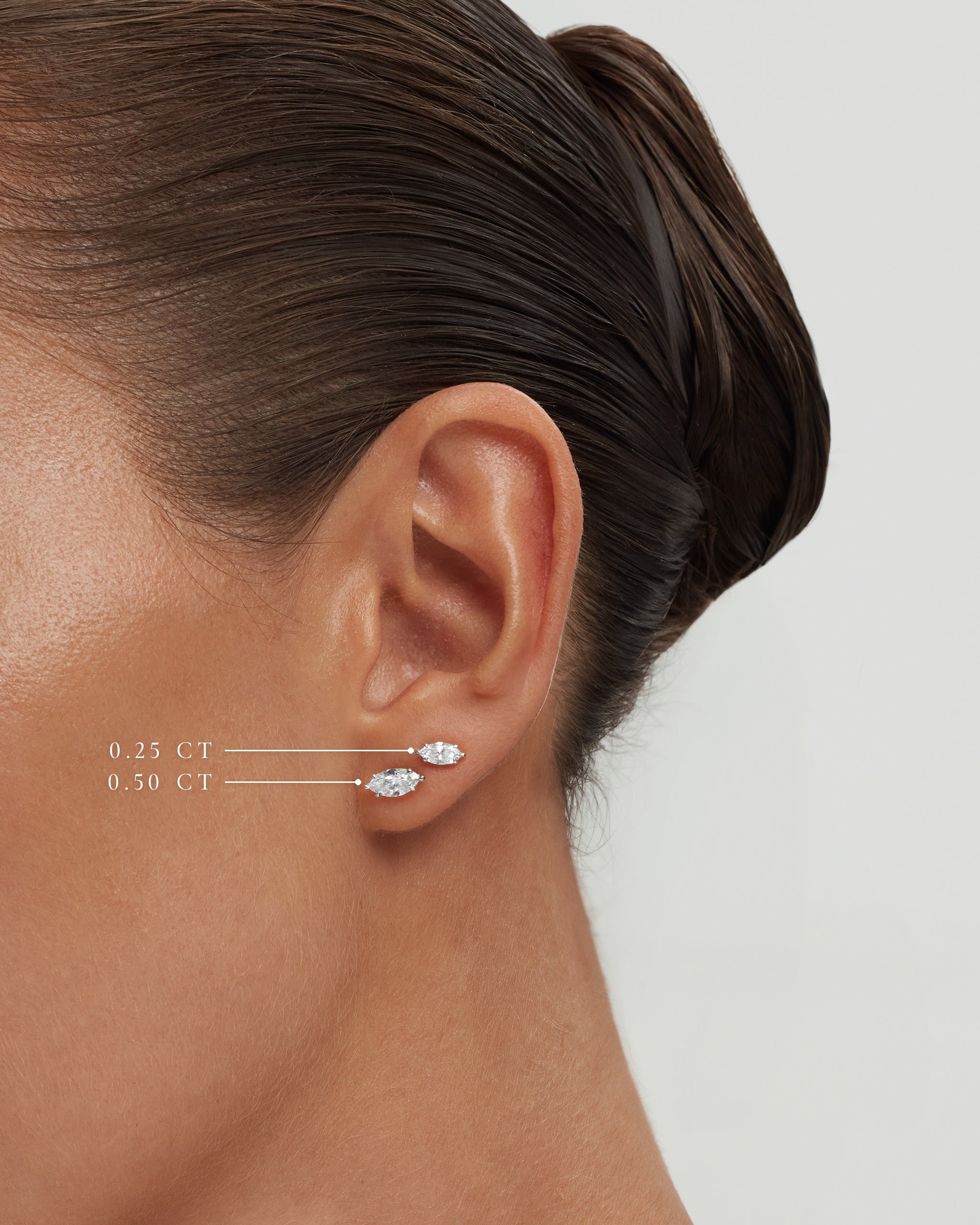 Marquise diamond studs in white gold on the ear, 0.25 and 0.50 carat sizes labelled, ENEA Studio