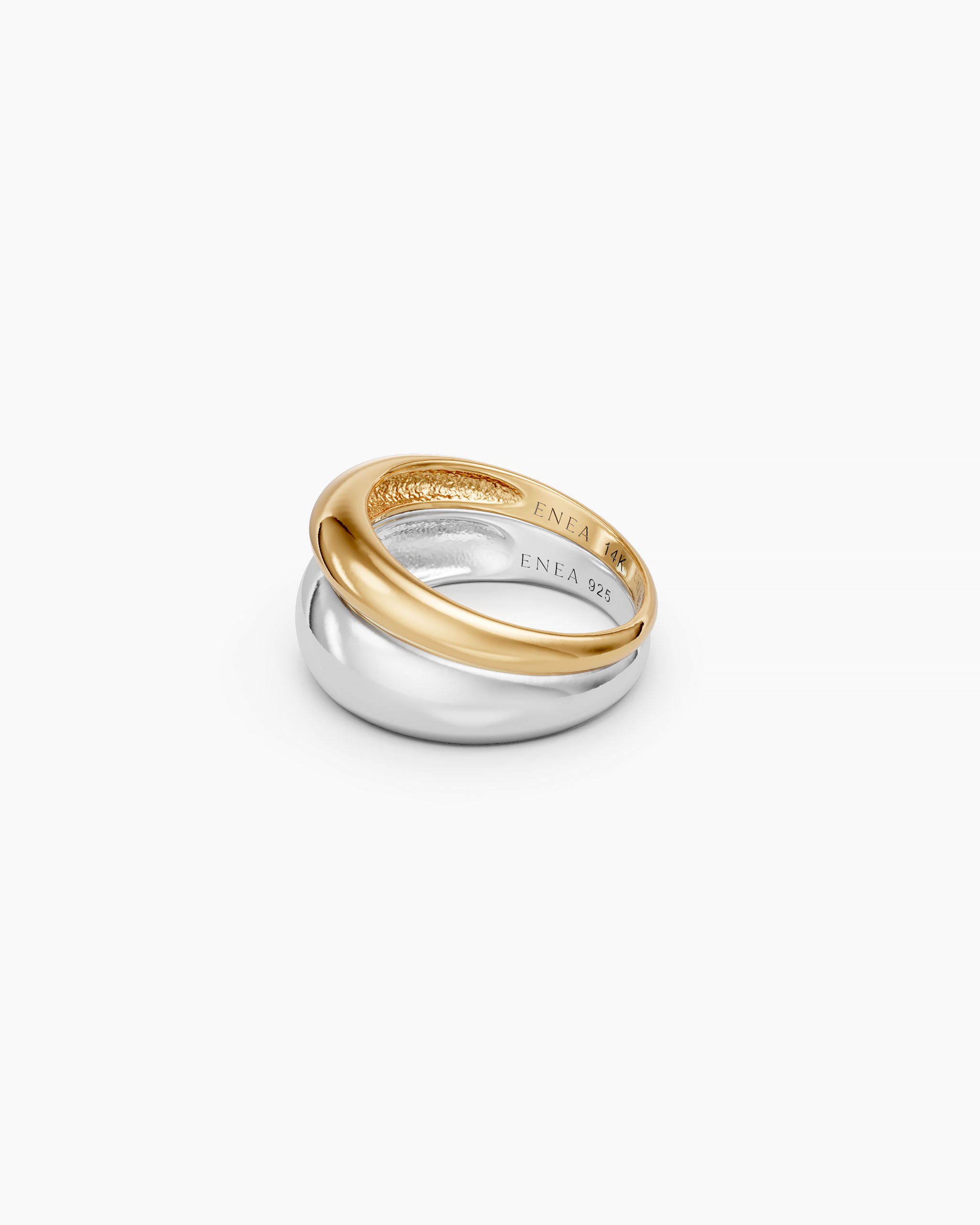 DYO Dome Stacking Ring set on white background, gold band stacked on silver dome, ENEA 14K and ENEA 925 hallmarks visible.