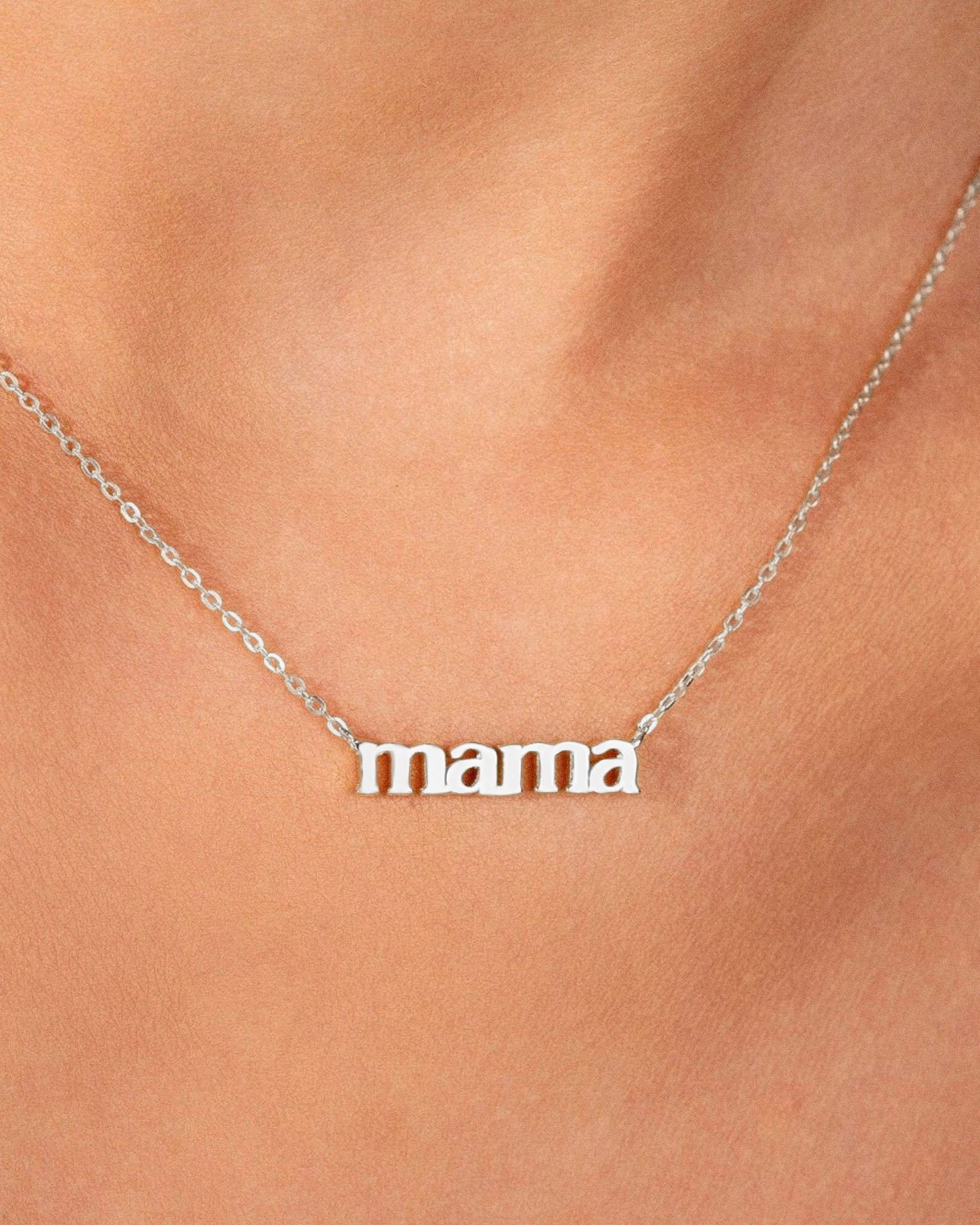 White Gold 'mama' necklace on a person's neck