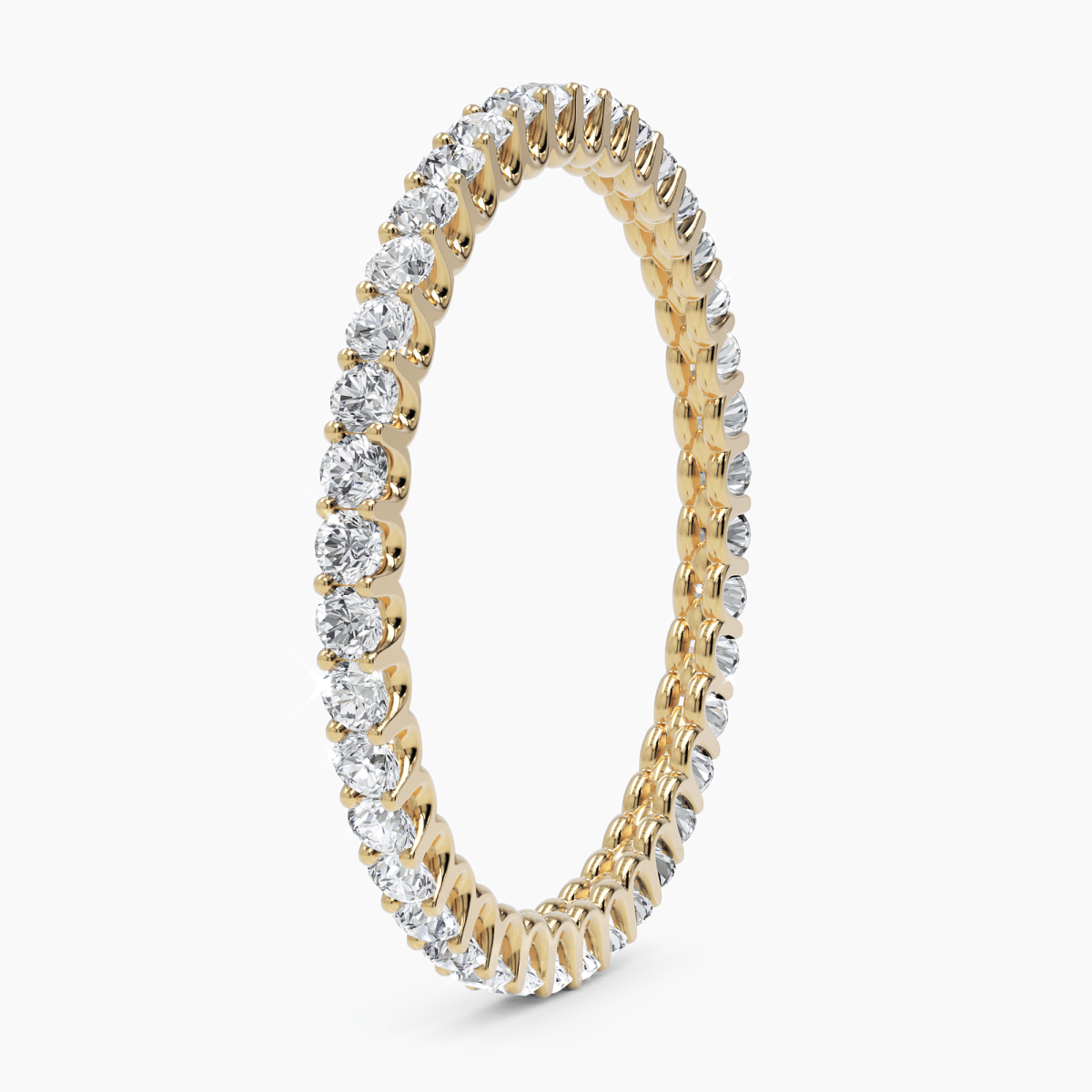 side angled view of the diamond eternity ring, displaying the meticulous craftsmanship and secure diamond setting in 14k gold
