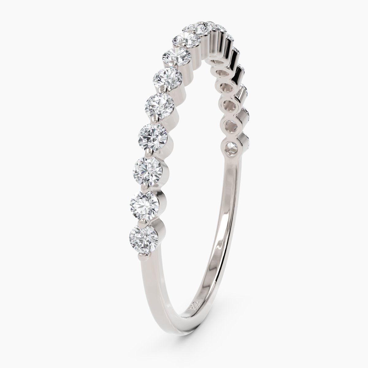 side view of the diamond eternity band in white gold, highlighting the intricate prong setting and full-circle sparkle
