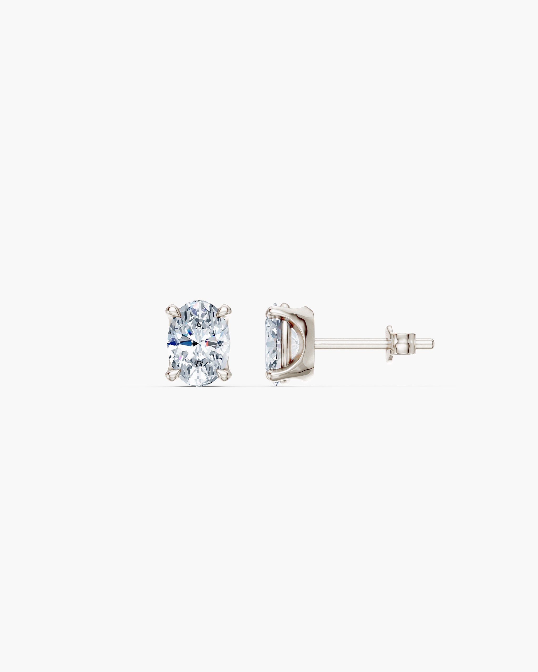 Oval lab diamond stud in 14k white gold, front and side view showing the four prong basket and push back, ENEA Studio