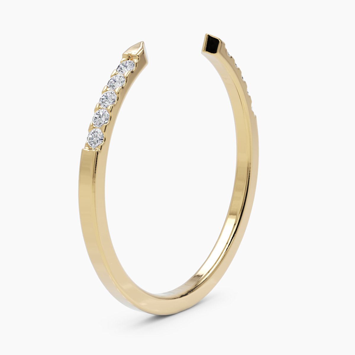 angled view of the open cuff diamond ring in yellow gold, displaying its fluid, open-ended silhouette and the brilliance of its pavé diamonds