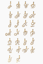 Set of 14K gold letter pendants on a white background