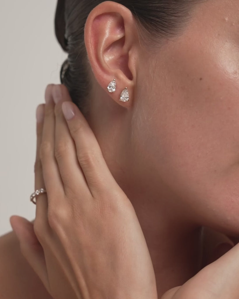 Pear lab diamond stud earrings in 14k yellow gold on the model, video, ENEA Studio