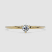 A 360-degree video of a 14k yellow gold solitaire diamond ring, rotating to display its delicate band and round brilliant-cut diamond in a classic four-prong setting. The video highlights the ring’s fine craftsmanship and elegant shine from every angle.