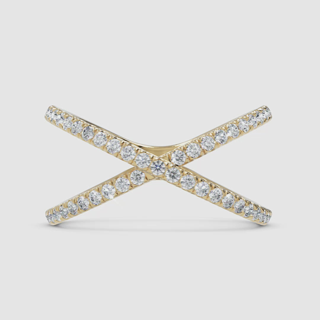A 360-degree video of a 14k yellow gold diamond X crossover ring, smoothly rotating to highlight its intersecting pavé diamond bands and contemporary design.