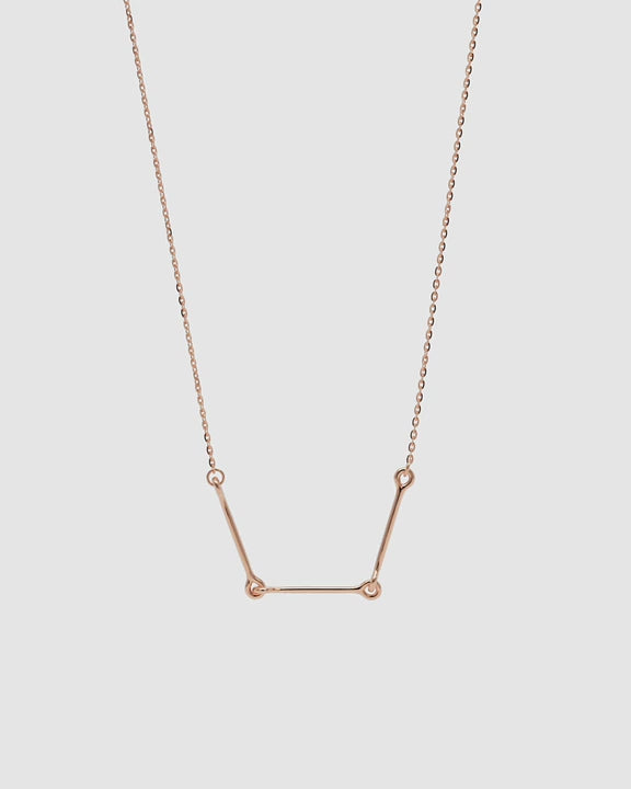 360 video of the Iris Necklace in 14k rose gold, featuring three polished bars connected with rounded loops.