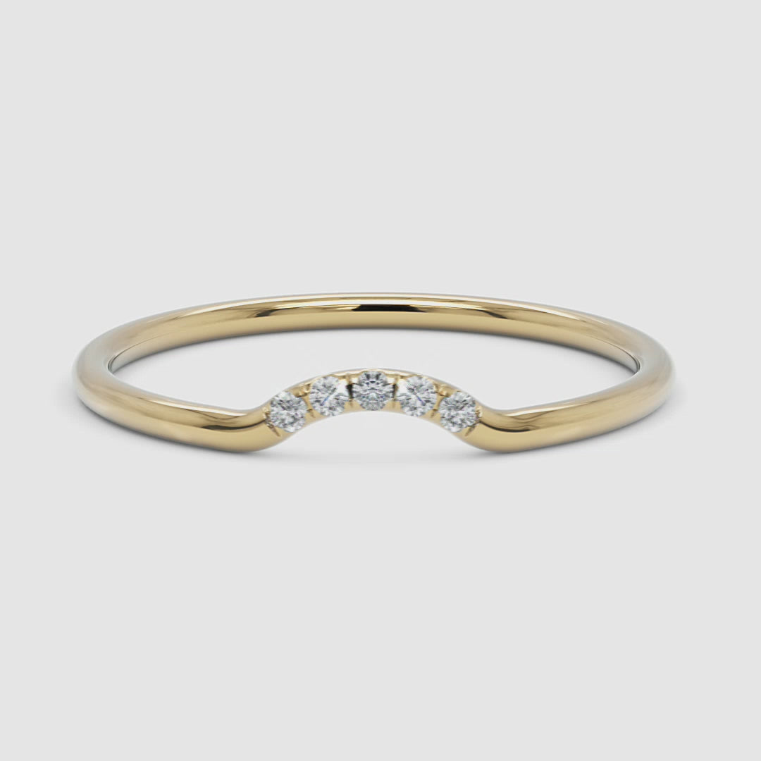 360 video showcasing the curved diamond ring in yellow gold, rotating to reveal its polished finish and shimmering diamonds
