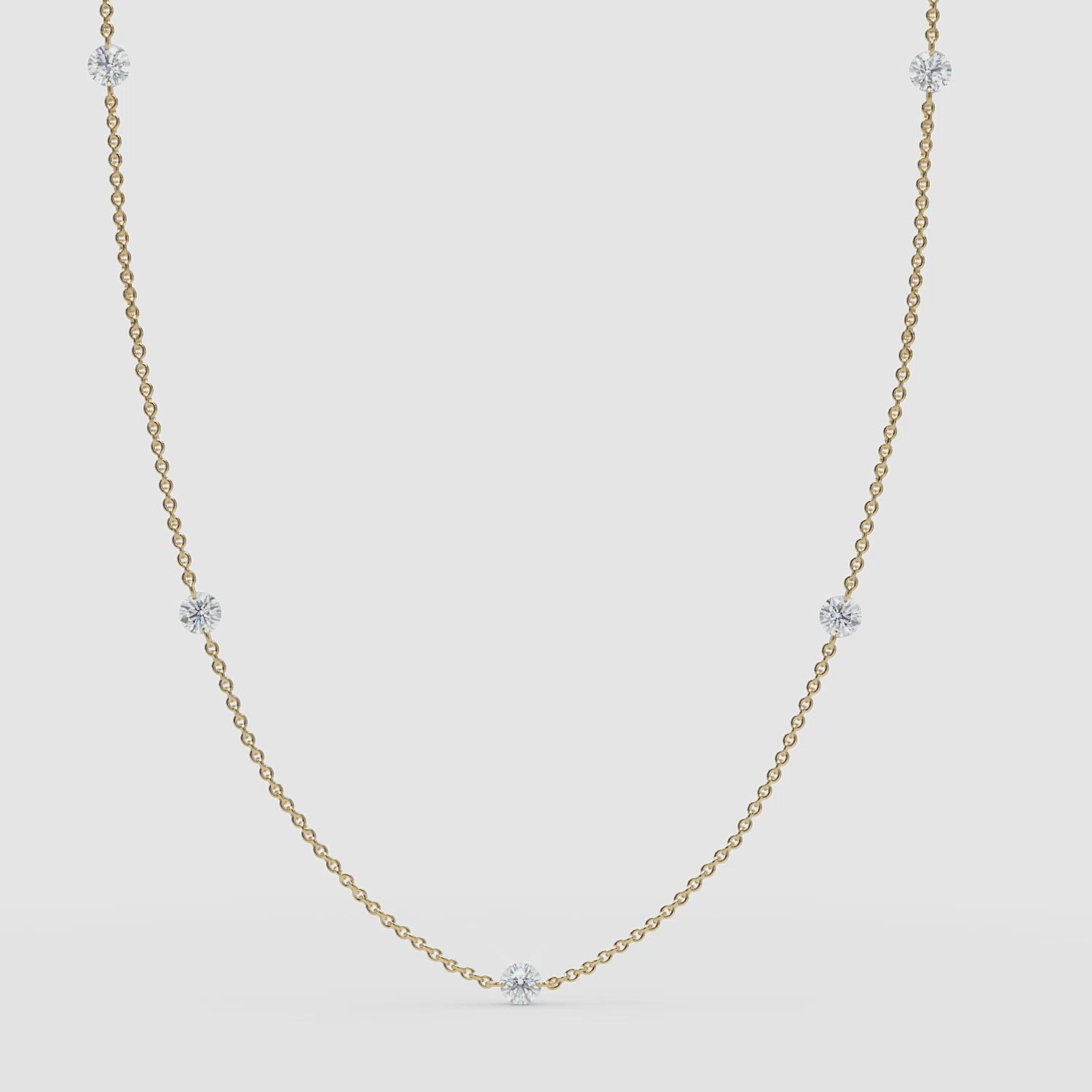 Video: Classic 14k solid yellow gold version of the diamond station necklace with a clean, minimal 360 presentation.

