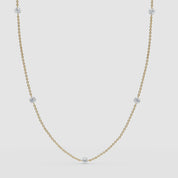 Video: Classic 14k solid yellow gold version of the diamond station necklace with a clean, minimal 360 presentation.

