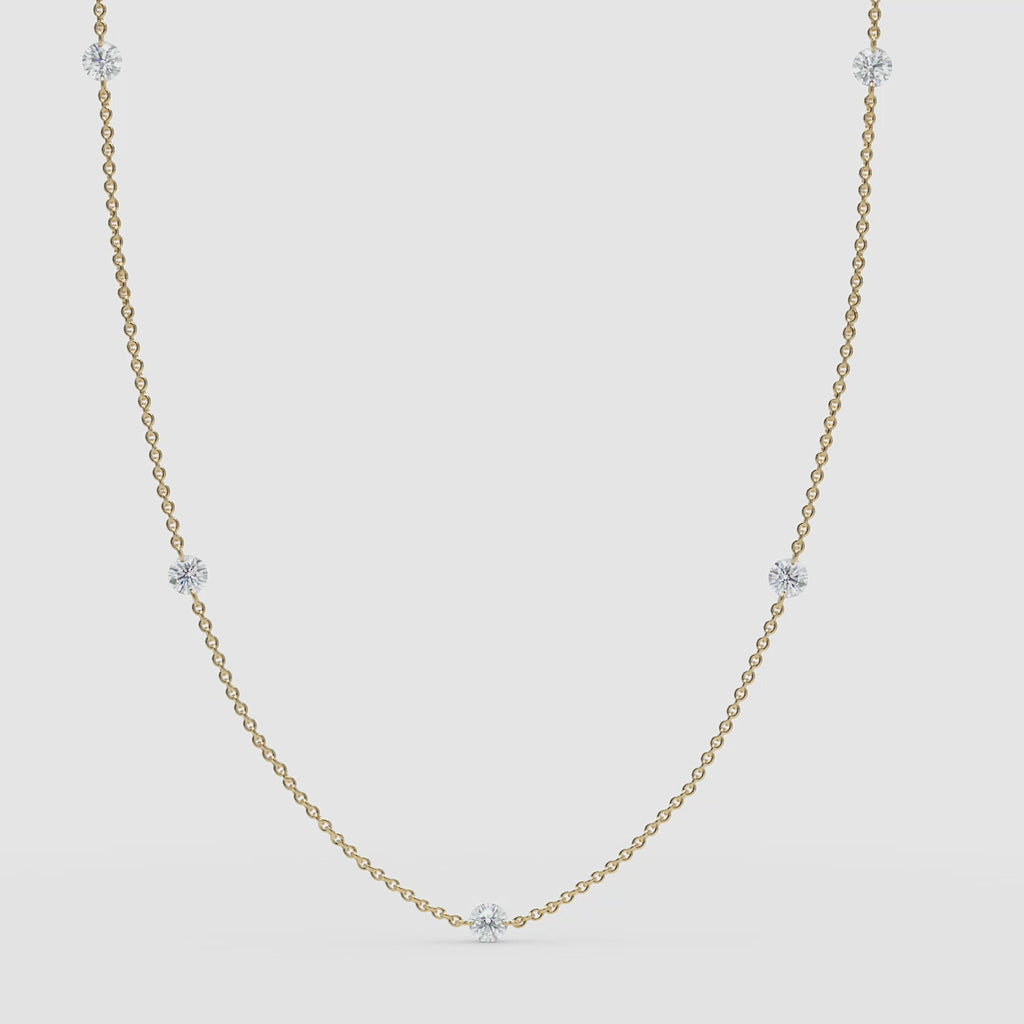 Video: Classic 14k solid yellow gold version of the diamond station necklace with a clean, minimal 360 presentation.

