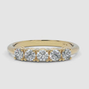 360-degree video of the yellow gold five-stone diamond ring, smoothly rotating to reveal the prong-set diamonds and polished gold band
